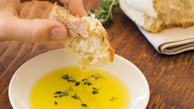 getty_rf_photo_of_bread_dipped_in_olive_oil