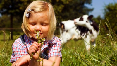 getty_rf_photo_of_young_farmgirl_smelling_wildflowers